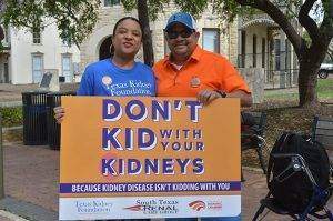 Couple holding awareness sign