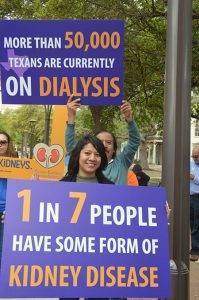 Woman marching with kidney disease sign