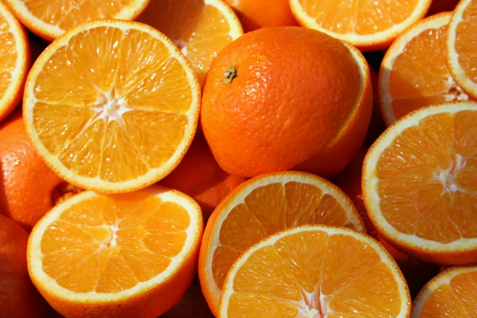 Fresh oranges cut in half